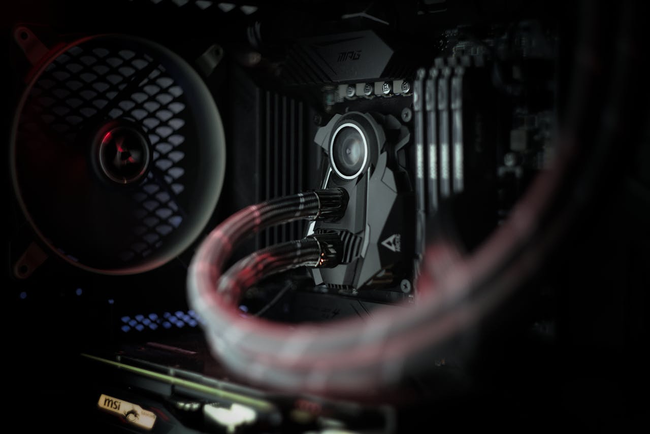 about-03 Detailed view of a computer's cooling system showcasing advanced technology with illuminated components.